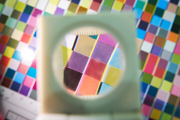 A close up detail magnifying glass showing the dot matrix printing technique using half tone and...