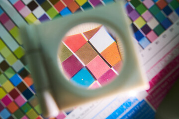 A close up detail magnifying glass showing the dot matrix printing technique using half tone and...