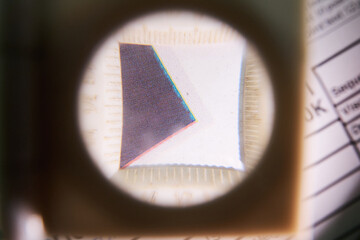 A close up detail magnifying glass showing the dot matrix printing technique using half tone and...