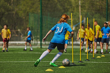 Sport Training for Kids. Young athletes participate in structured training drill, focusing...
