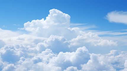 A towering cumulus cloud formation, its pristine white surface reflecting the azure sky, capturing the essence of a tranquil summer day.