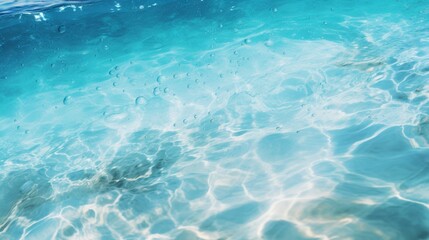 A tropical beach water pattern with vibrant turquoise water and delicate bubbles floating on the surface of the water.
