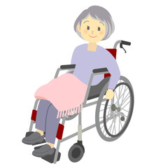 車いすを自分で運転する笑顔のおばあさん（全身）介護、看護、デイサービス
