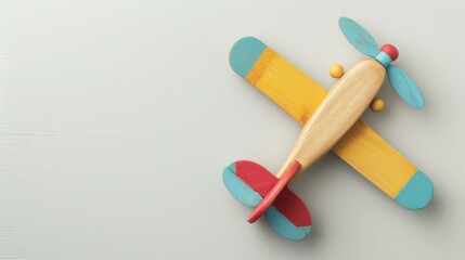 Obraz premium Colorful wooden toy plane on light gray background