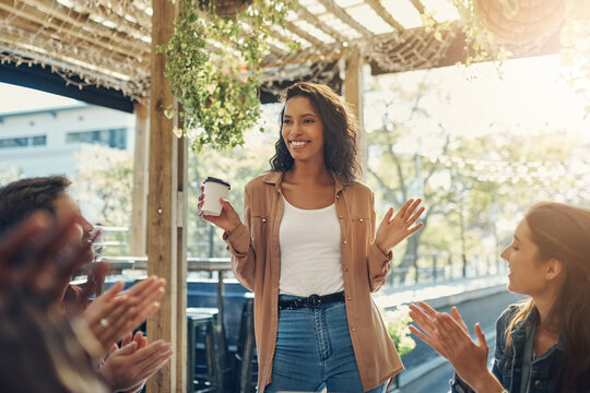 Happy woman, coffee and presentation with applause for meeting, thank you or discussion at cafe. Young female person with group of employees clapping for promotion or team building at coffee shop