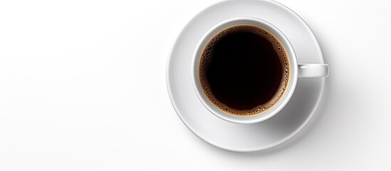 Top view of black coffee in a white cup on a plate isolated on a white background with clipping path for copy space image