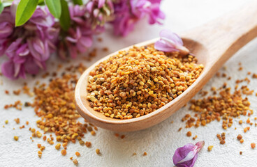 Healthy bee pollen grains.  Bee pollen on a wooden spoon