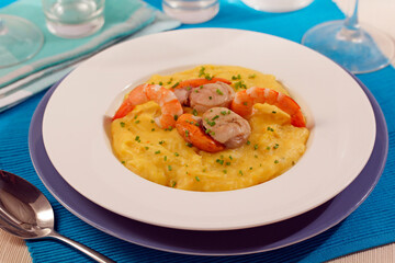 Potato cream with shellfish.