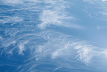Vibrant Cirrus Clouds in Clear Blue Sky, Inspiring a Sunny Day of Freedom and Joy