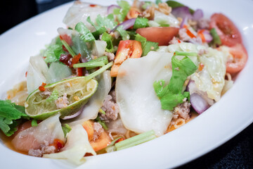 Thai salad is Spicy Glass Seaweed noodle Salad with Minced Pork.