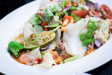 Thai salad is Spicy Glass Seaweed noodle Salad with Minced Pork.