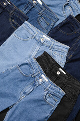 Close-up of blue jeans back pockets in various shades of blue denim.
