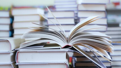 open book on the table. stack of books. back to school