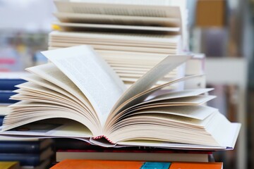 open book on the table. stack of books. back to school