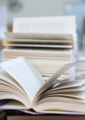 open book on the table. stack of books. back to school