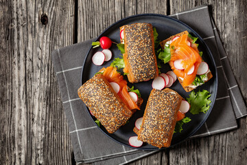 smoked salmon sandwiches on rye bread rolls