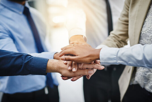 Business people, about us or hands in stack for closeup, teamwork or support for corporate goals. Meeting, group and partnership with collaboration for motivation, target or staff synergy for mission