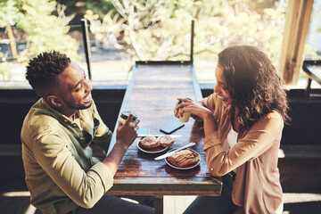Happy, couple and laughing with food at cafe for funny conversation, humor and bonding together. Woman, man and love with coffee on date at restaurant for breakfast, beverage and nutrition in morning