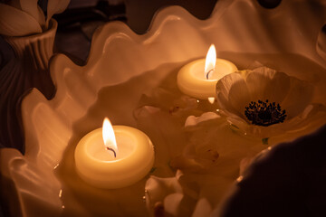 the burning candle on a  table