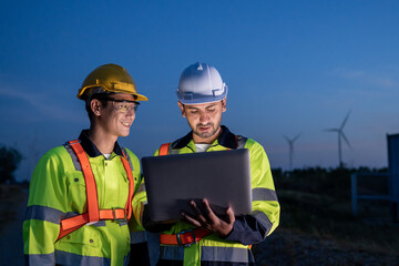 Diverse ethnicity male technicians working in the wind turbines field. 