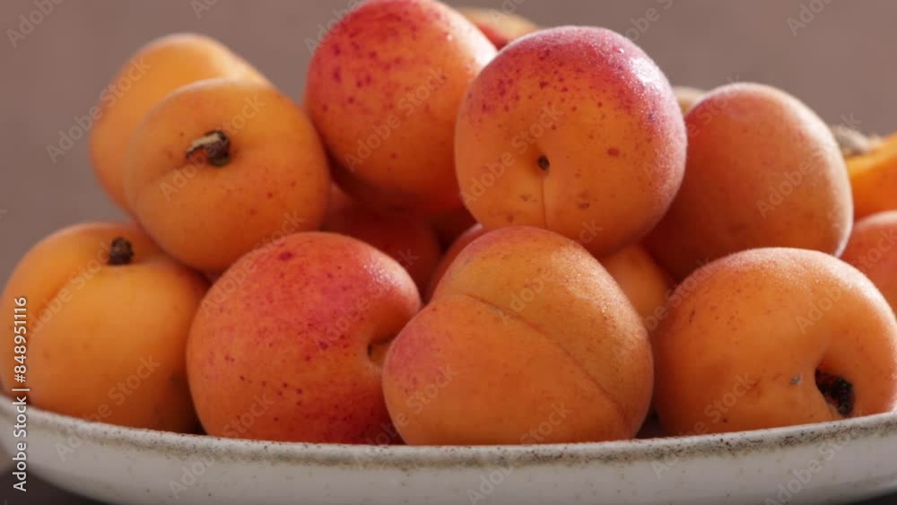 Wall mural ipe apricots rotation on plate fruits summer