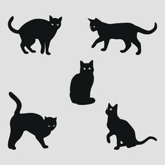 Black silhouettes of cats. Pet. Vector on a gray background