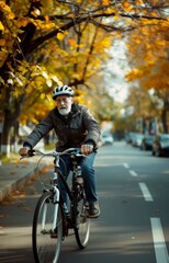Fototapeta premium Elderly Man Cycling in Autumn Park