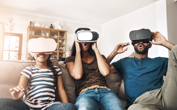 Headset, virtual reality and wow with family on sofa in living room of home together for watching tv. Entertainment, movie or streaming with mother, father and daughter in apartment for VR surprise