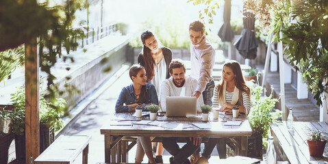 Planning, teamwork and business people in meeting, laptop and cooperation with ideas, summer or feedback. Group, employees or coworkers with computer, project or collaboration with creative agency © JorSons/peopleimages.com
