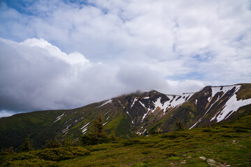 Wonderful nature. Rocky land, high mountains, dramatic sky.