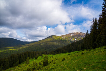 Wonderful nature. Rocky land, high mountains, dramatic sky.