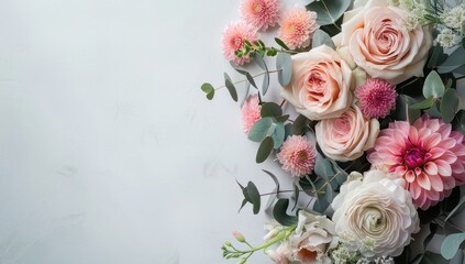 A bouquet of flowers with pink and white flowers and a green leaf. The flowers are arranged in a way that they are not overlapping each other