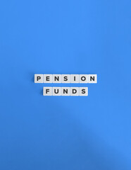Pension Funds Banner. Text on Block Letter Tiles on Flat Background with Copy Space. Minimal Aesthetics.