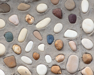 Sea stones in the wall as an abstract background. Texture