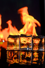 cubes of ice and fire on a water surface on an abstract background 1