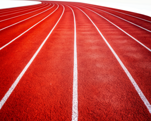 A Curvy Empty Red Running Track With White Lines