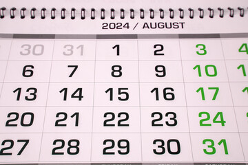 Obraz premium The page of the annual paper calendar for the month of August 2024