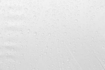Rain drop on white fabric background, clear drop on white fabric pattern background