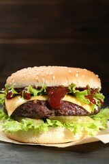 Burger with delicious patty on table, closeup