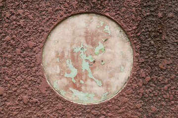 Unique background with perfect circle in the center symbolizing planet earth, textured wall surface with circle, damaged Earth concept