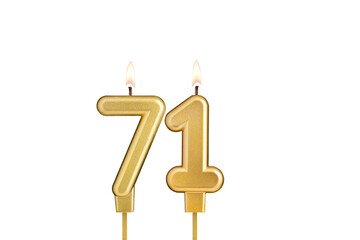 Golden number 71 birthday candle on white background