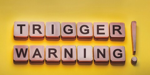 Mental triggering concept. Trigger warning message on a yellow background. 