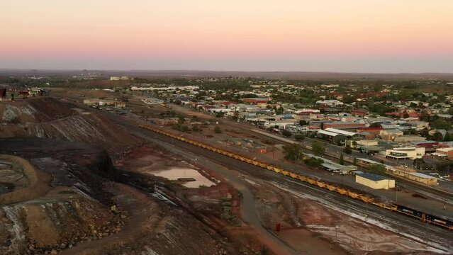 Railway tracks and station in Broken Hill city with freight train by the mine as 4k.
