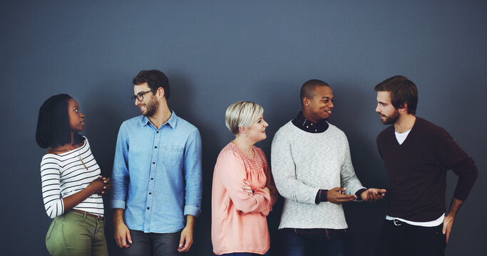 Diversity, waiting room or business people speaking of job opportunity, creative career or application. Networking, group or men in conversation with women for recruitment hiring or startup interview