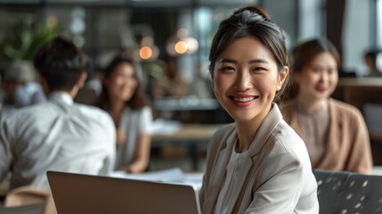 smiling Young Asian woman using laptop working