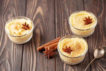Curau de Milho (Brazilian Corn Pudding). Traditional Brazilian dessert. Corn porridge with cinnamon in a bowl.