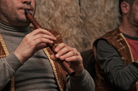 Folk musician playing the duduk .