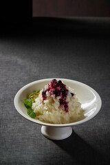 cold appetiser vegetable mash potato with lime sweet fruit blueberry jam sauce peppermint in plate on rock table asian healthy halal vegan food cuisine restaurant banquet menu for cafe