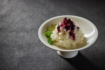 cold appetiser vegetable mash potato with lime sweet fruit blueberry jam sauce peppermint in plate on rock table asian healthy halal vegan food cuisine restaurant banquet menu for cafe
