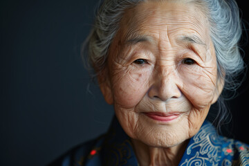 Close-up portrait of elderly Asian woman, studio photo